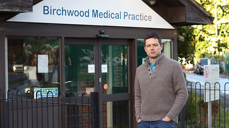 Chris in front of medical practice