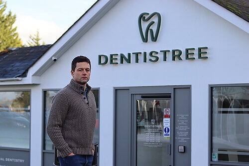 Chris in front of dental practice