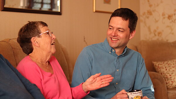 Chris chatting with a resident